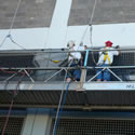 Installing 3/8 inch bat netting at a local jail from a window washer swing stage about 80' up in the air.